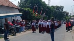 MURID SD DAN SMP MEMERIAHKAN HUT KE-81 DAN MENGIKUTI LOMBA GERAK JALAN DI KECAMATAN LABANG KABUPATEN BANGKALAN