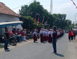MURID SD DAN SMP MEMERIAHKAN HUT KE-81 DAN MENGIKUTI LOMBA GERAK JALAN DI KECAMATAN LABANG KABUPATEN BANGKALAN